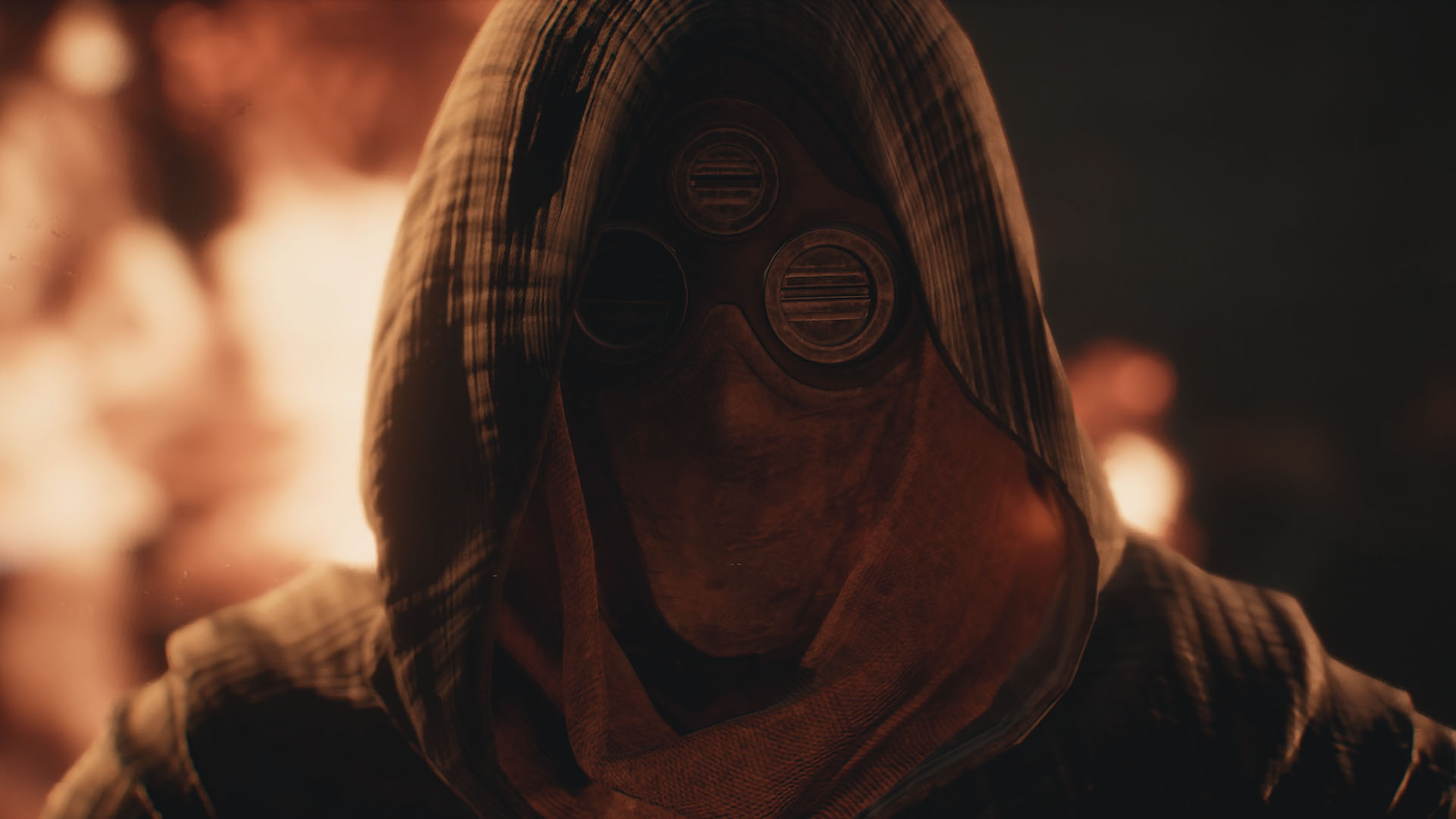 Close-up of a hooded Fremen-style character wearing a weathered breathing mask